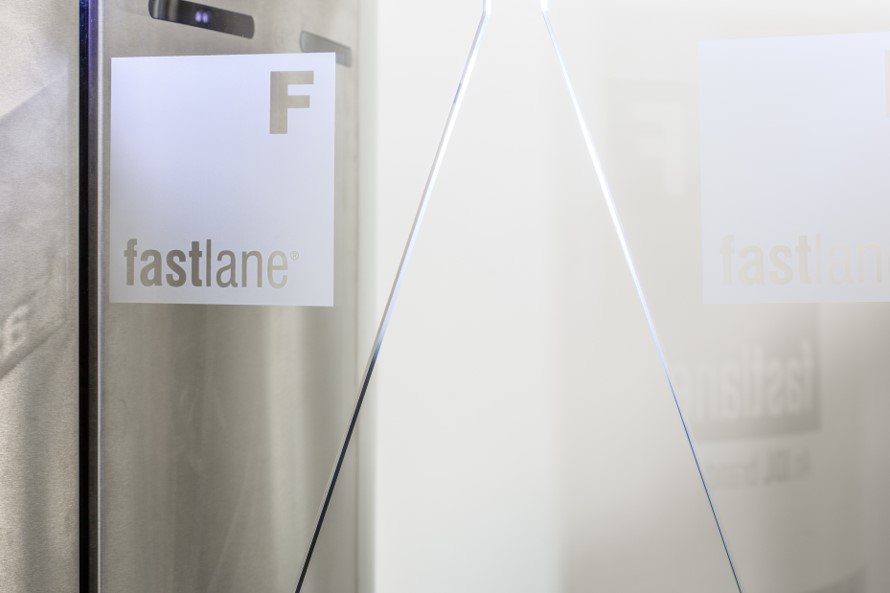 Fastlane logo displayed on entrance control security turnstile glass wing